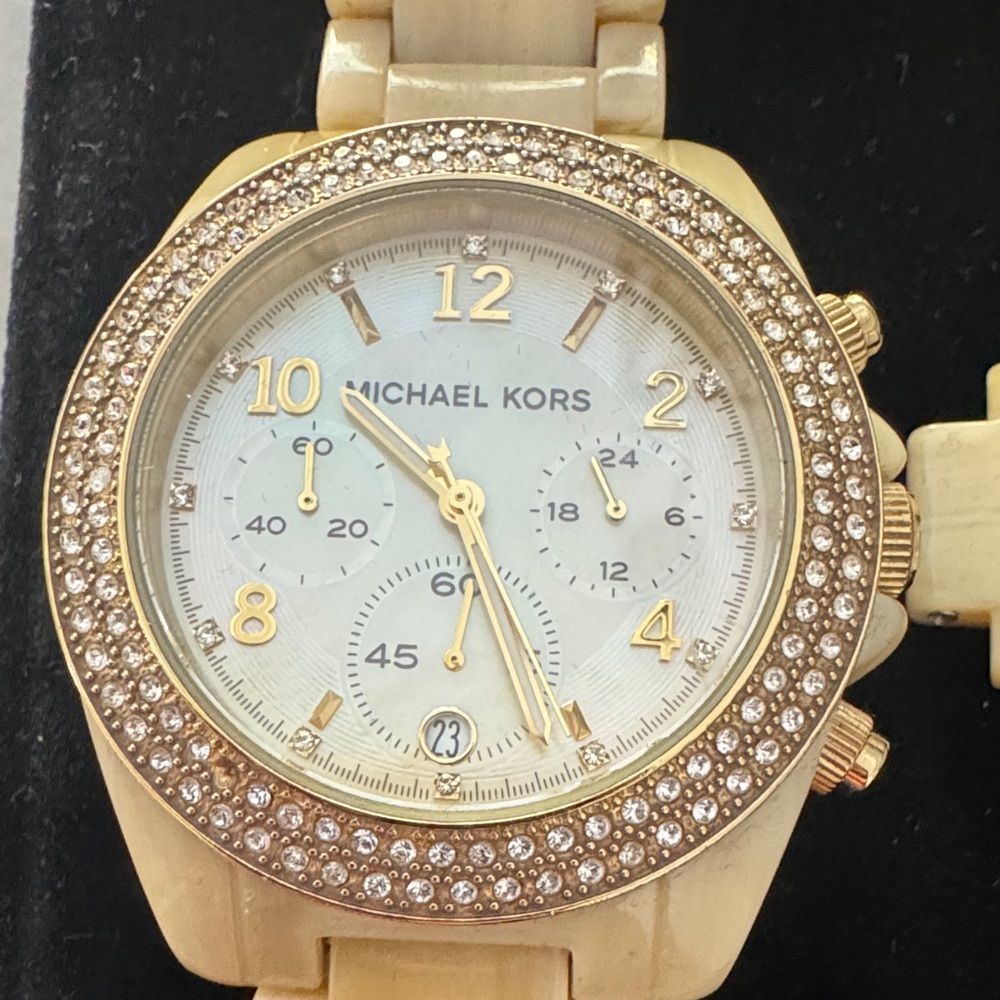 Michael Kors Gold Chronograph Watch with Crystal Bezel
Missing one small gem